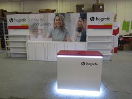 Custom Inline Exhibit with Tension Fabric Graphics, (3) Backwall Counters with Locking Storage, Adjustable Shelves, and (1) MOD-1579 Reception Counter with Wireless Charging and Locking Storage
